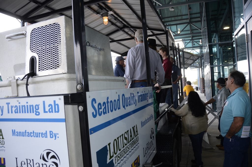 Photo of group learning at the LFF Seafood Quality Training Lab trailer