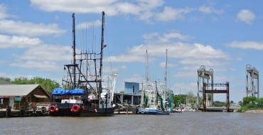 shrimp boats docked along the canal in Delcambre