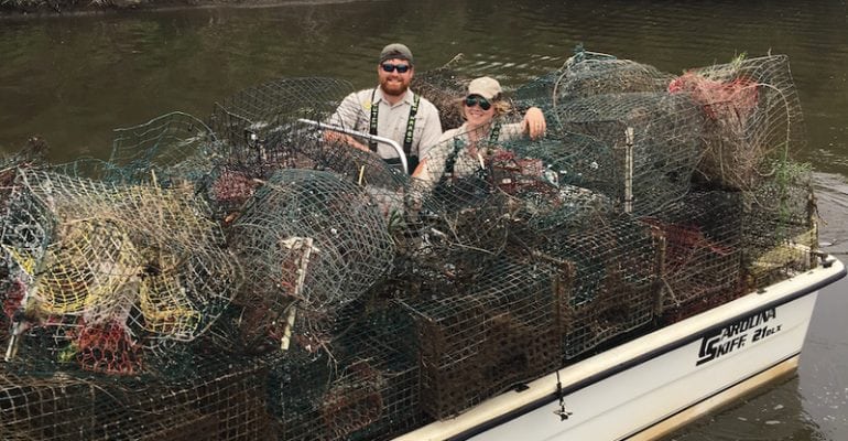 Boat full of recovered abandoned traps.