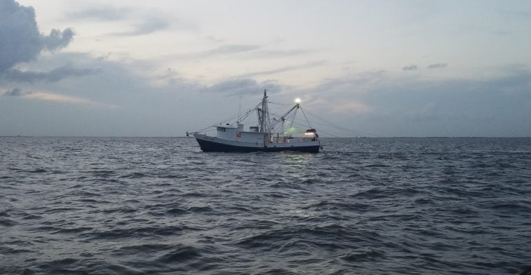 shrimp boat in Gulf of Mexico at dusk