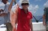 Thu Bui holding caught red snapper