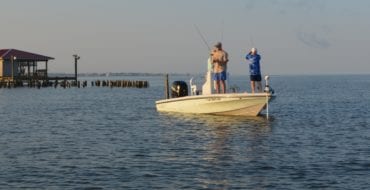 two men fishing out of boat on Big Lake