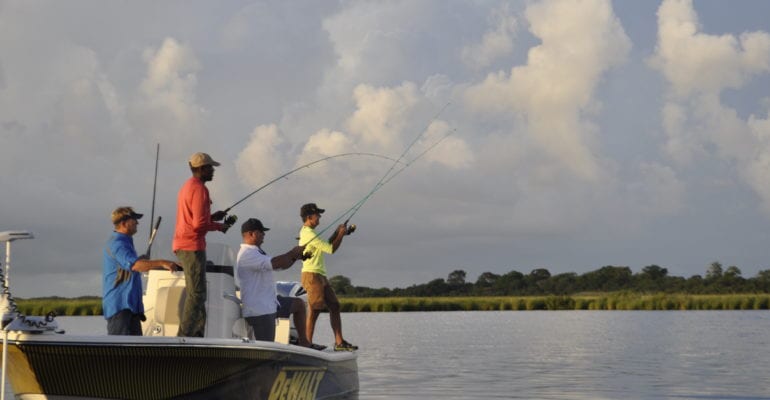 four men fishing from inshore charter boat