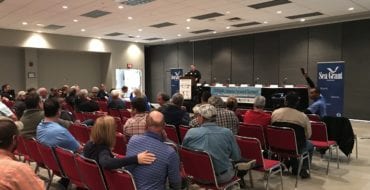 Speaker addressing crowd at Summit