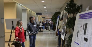 Summit participants looking at abstract posters in 2018