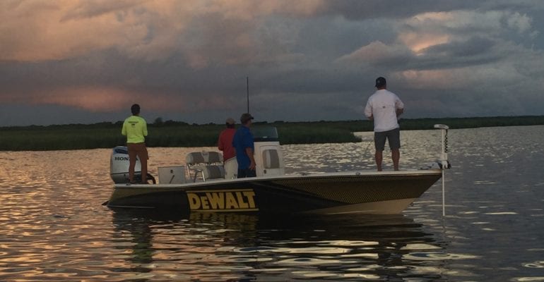 fishing at sunrise with charter guide