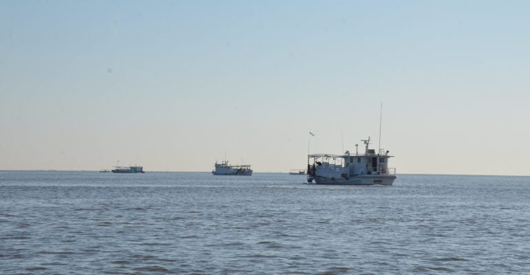 photo of three oyster boats in Gulf waters
